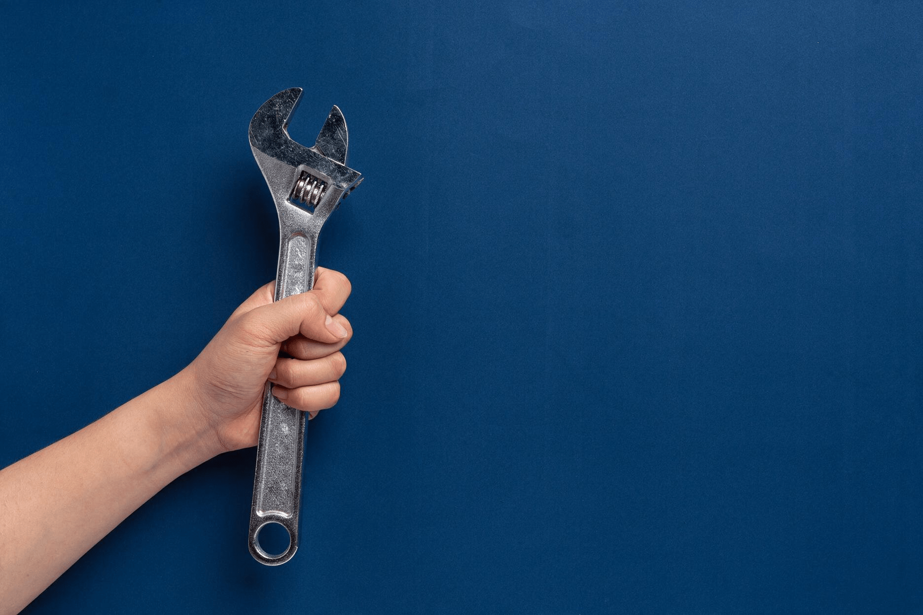 Woman holding metal wrench